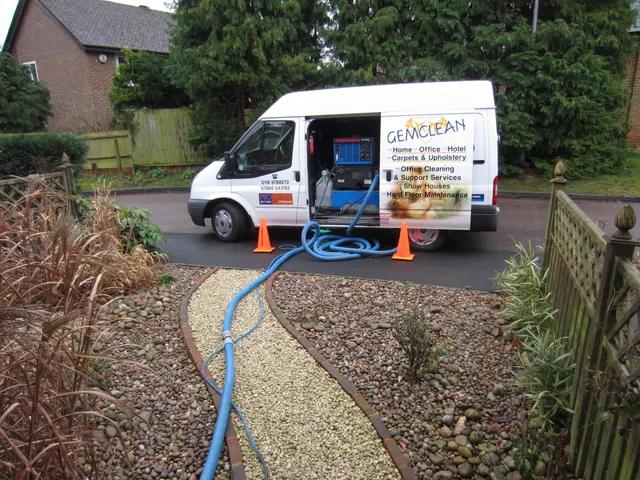 Hoses run from the van, along the garden path and into the house