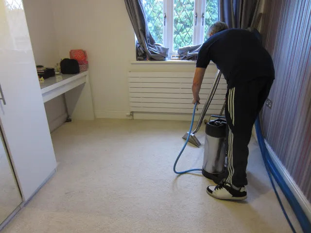 Working across the bedroom carpet by the window