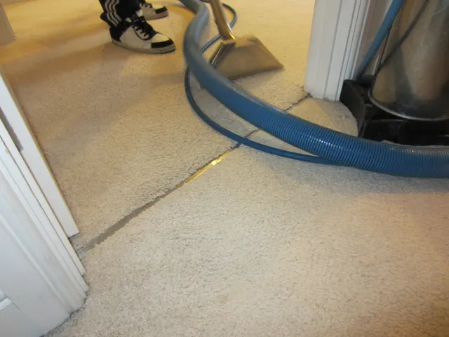 Cleaning the carpet at a doorway