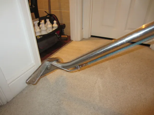 Edging the carpet at a doorway, products ready behind