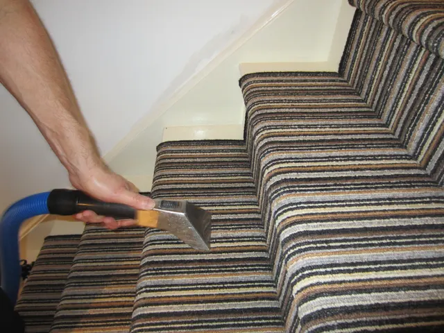 Hand tool on a striped stair runner